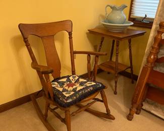 Antique rocking chair and small oak table.