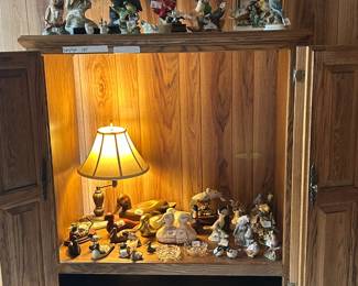 Ducks, eagles, owls.  Beautiful solid wood TV Cabinet.