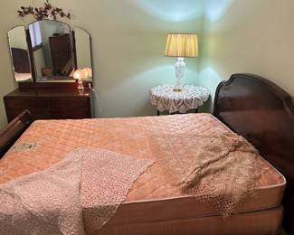 Dresser with mirror; bed