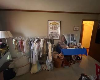 Aprons, vintage baby clothes, misc "men's" decor.