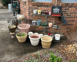 Numerous quality flower pots. Plant stands. Metal shepherd’s hooks. 
