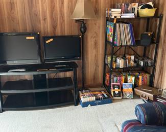 Two "dumb" tv's.  TV stand.  Numerous DVD's, albums, and records.