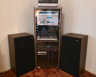 Vintage Pioneer stereo system with floor speakers and turntable