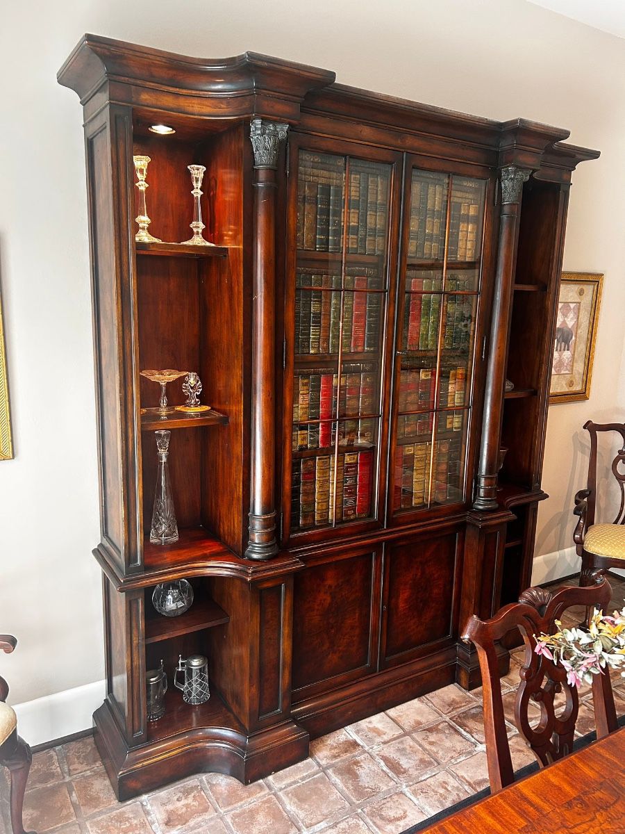 Rare Theodore Alexander Faux book laurel burl open library bookcase  Very good condition. Some imperfections shown in photos. Top and bottom separate Has key. Height: 92.13 in (234 cm) Width: 85.83 in (218 cm) Depth: 15.36 in (39 cm) P Must be able to move and load yourself.