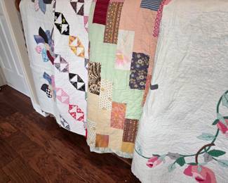 Many quilts, hand sewn