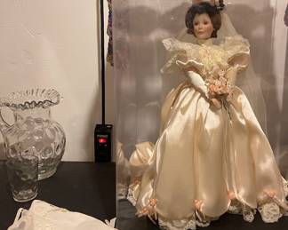 SHOWCASED DOLL IN SATIN ATTIRE