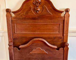 Single twin-sized walnut bed...