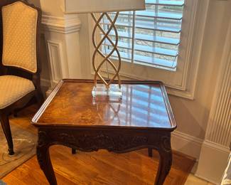 French country style walnut accent table with ornate wood carvings on all sides and legs measures 28 wide by 22 inches and a half long by 22 inches tall
