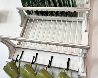 Distressed white wooden wall mounted plate and cup rack measures 33 inches tall by 25 inches wide by 10 inches deep