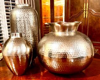 Largest vase is 16" tall and 17" around, tallest 21" tall and 10" around