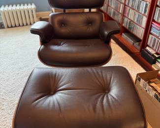 Eames Lounge Chair and Ottoman with Walnut Veneer and Brown Leather Fabric. Photo 1 of 3. 