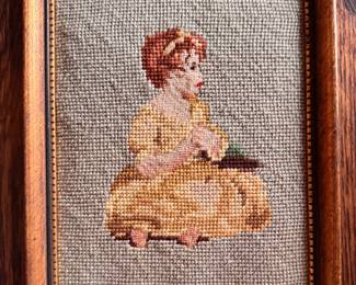 "Kneeling Young Female" Framed Needlepoint Portrait. Measures 8.4" x 11" Overall. 