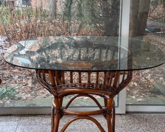 Bamboo and Rattan Glass Top Dining Table. Measures 42" D x 29" H. Photo 1 of 2. 