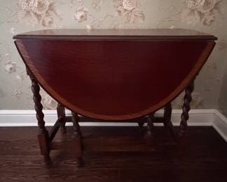 Satinwood Banded Mahogany Drop-Leaf, Barely-Twist Gate-Leg Table. Measures 46" x 34" x 29" H with Two 15.5" Drop Leaves. Photo 1 of 4. 