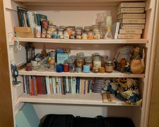 lots of books, luggage, candles and more