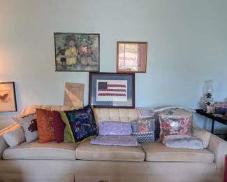 lots of throw pillows, white sleeper sofa