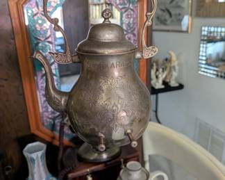 a vintage, traditional Middle Eastern coffee pot known as a "dallah".
