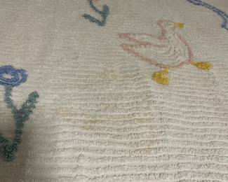 C148 - $20. 1950s Chenille Blanket. Measures 39" x 62". Has some discoloration. 