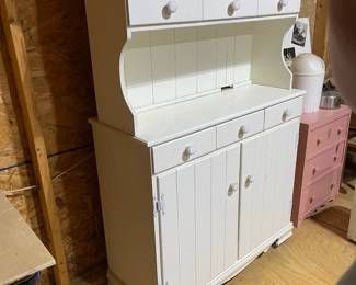 C84 - $40. Vintage White Hutch. Moves in 2 pieces for easier transport. Castors attached. Top is 36" wide x 9.5" deep x 38" tall. Base is 37" wide x 15" deep x 33" tall. 