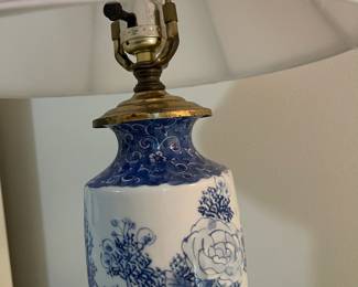 C153 - $30. Blue & White Lamp on Wooden Base. Measures 24" tall. Shade is in good condition!