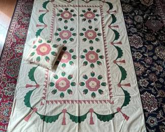 C154 - $65. Hand Pieced & Quilted Blanket & Matching Pillow with initials "EC" . Pillow is 14" square. Blanket is 57" x 86". Does have some light staining & 1 blue paint spot.  