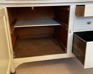 C58 - $300. Sellers Hoosier. Has been painted white. Enamel top is in good condition - some chipping that is normal for it's age. Measures 40.5" wide x 27.5" deep x 69" tall.  We have a couple bags of original hardware / tags that were taken off when it was painted. 