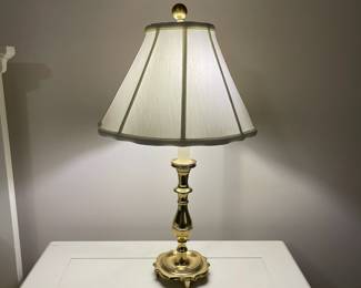 C149 - $30. Harvin Vintage Brass Lamp. Measures 24" tall. Shade has a small tear inside. 