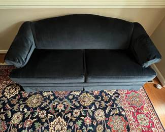 C77 - $175. Dark Blue Upholstered Sofa. Measures 74" wide x 32" deep x 33" tall. Floor to seat is 18". Seat is 22" deep. 