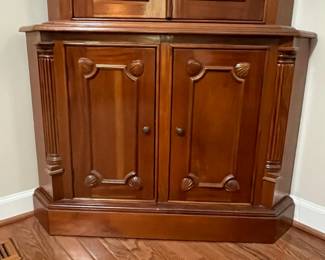 C95 - $225. Solid Wood Corner Cabinet - Moves in 2 Pieces. Measures 24" out from each corner and  39" across the front. 76" tall. Moves in 2 Pieces. 