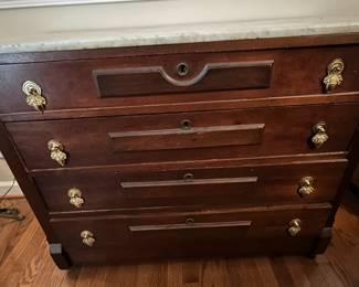 C47 - $125. 4 Drawer Marble Top Chest. Measures 41" wide x 18" deep x 32" tall. Drawers show their age and need a little patience. 