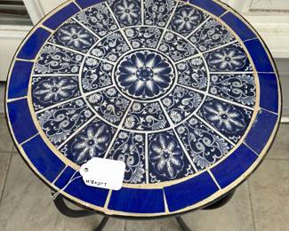 C75 - $25. Tile Top Table with Metal Base. Measures 14" round x 21" tall. 