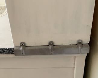 C58 - $300. Sellers Hoosier. Has been painted white. Enamel top is in good condition - some chipping that is normal for it's age. Measures 40.5" wide x 27.5" deep x 69" tall.  We have a couple bags of original hardware / tags that were taken off when it was painted. 