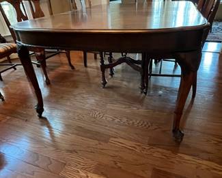 C13 - $350. Antique Mahogany Dining Table. Measures 59" long with NO leaf. 48" wide x 30" tall. (Has 3 Leaves - each adds 12" )  1 arm chair + 6 regular chairs. Was refinished in 2011. Solid table but it is an antique and has some issues from general use. Some wiggles and some veneer issues. 