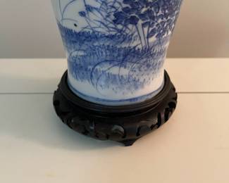 C153 - $30. Blue & White Lamp on Wooden Base. Measures 24" tall. Shade is in good condition!
