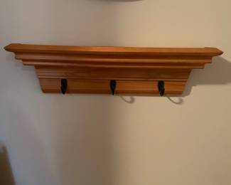 C41 - $25. Small Wooden Wall Shelf with hooks. Measures 23.5" wide x 4.5" deep x 6" tall. 