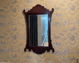 C122 - $150. Antique Chippendale Mirror. Mirror has been replaced and features a beveled edge replacement. Measures 22" wide x 35.75" tall. 