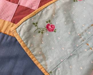 C147 - $50. Patchwork Quilt. Measures 49" x 66". Has some fading and discolored / stained spots. 