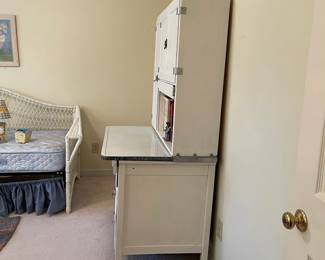 C58 - $300. Sellers Hoosier. Has been painted white. Enamel top is in good condition - some chipping that is normal for it's age. Measures 40.5" wide x 27.5" deep x 69" tall.  We have a couple bags of original hardware / tags that were taken off when it was painted. 