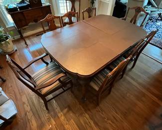 C13 - $350. Antique Mahogany Dining Table. Measures 59" long with NO leaf. 48" wide x 30" tall. (Has 3 Leaves - each adds 12" )  1 arm chair + 6 regular chairs. Was refinished in 2011. Solid table but it is an antique and has some issues from general use. Some wiggles and some veneer issues. 