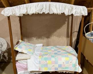 C110 - $60. Childs Toy Canopy Bed. Missing finials but could easily be replaced. Custom Handmade Bedding included. Measures 38.5" x 21.5" x 46" tall. 