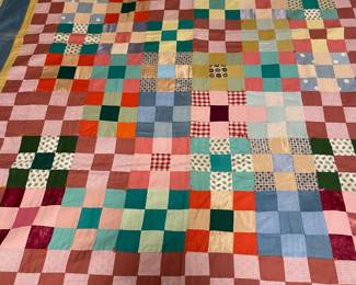 C147 - $50. Patchwork Quilt. Measures 49" x 66". Has some fading and discolored / stained spots. 