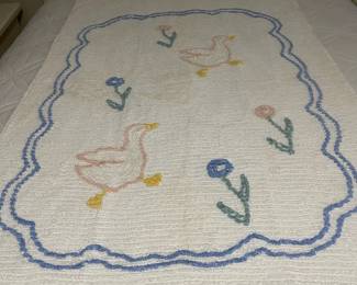 C148 - $20. 1950s Chenille Blanket. Measures 39" x 62". Has some discoloration. 
