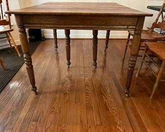C8 - $250. Solid Oak Dining Table with single leaf. Measures 42" x 52" x 31" tall. 5 regular chairs. 1 captains chair. Table is sturdy & solid!