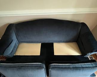 C77 - $175. Dark Blue Upholstered Sofa. Measures 74" wide x 32" deep x 33" tall. Floor to seat is 18". Seat is 22" deep. 