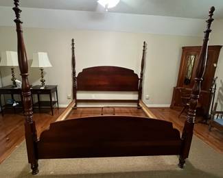 C4 - $250. King Sized 4 Poster Bed. No name. Some wear along the footboard. Measures 81.5" wide x 89" long x 80" tall. 