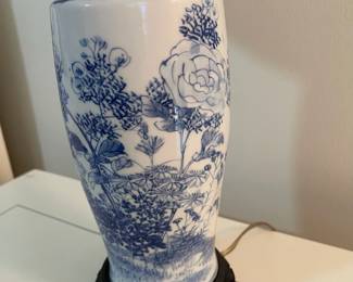 C153 - $30. Blue & White Lamp on Wooden Base. Measures 24" tall. Shade is in good condition!