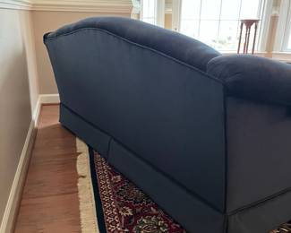 C77 - $175. Dark Blue Upholstered Sofa. Measures 74" wide x 32" deep x 33" tall. Floor to seat is 18". Seat is 22" deep. 
