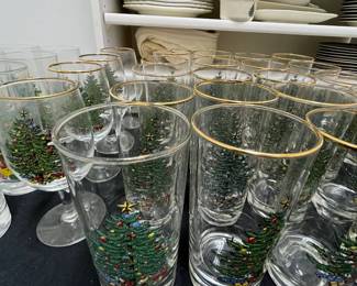 C137 - $150. Large Lot of Christmas Dishes. Glasses show the most wear on the gold trim. 