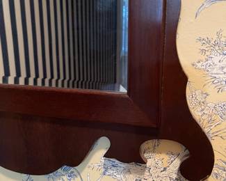 C122 - $150. Antique Chippendale Mirror. Mirror has been replaced and features a beveled edge replacement. Measures 22" wide x 35.75" tall. 