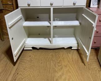 C84 - $40. Vintage White Hutch. Moves in 2 pieces for easier transport. Castors attached. Top is 36" wide x 9.5" deep x 38" tall. Base is 37" wide x 15" deep x 33" tall. 